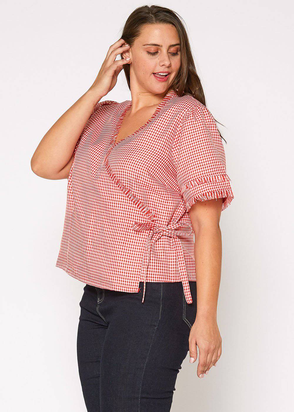 Plus Size Fringe Trim Gingham Wrap Blouse in Red Gingham